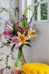 a vase of flowers in a room